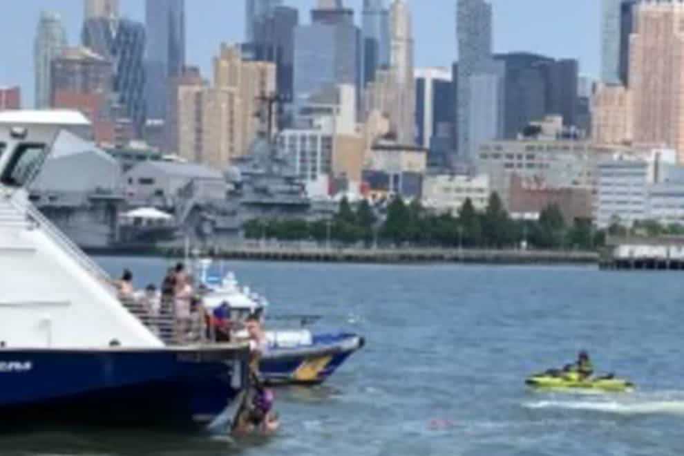 Ferry personnel rescuing people after a boat capsized in the Hudson River (NY Waterway/AP)