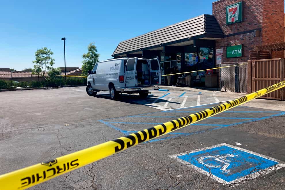 Two people were killed and others hurt in six robberies at 7-Eleven shops (Eugene Garcia/AP)