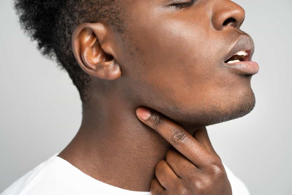 A sore throat could be a sign of Covid (Alamy/PA)
