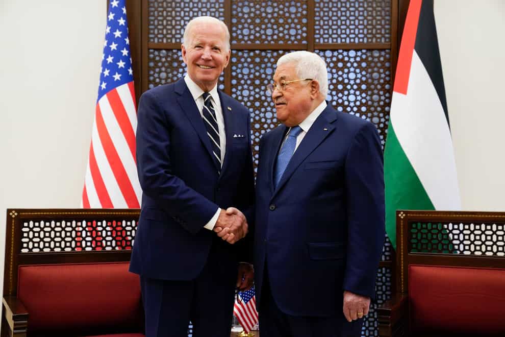 Palestinian President Mahmoud Abbas and US President Joe Biden shake hands in the West Bank town of Bethlehem (Evan Vucci/AP)