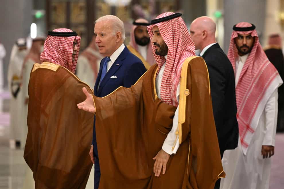 U.S. President Joe Biden, center left, and Saudi Crown Prince Mohammed bin Salman, center, arrive for the family photo during the “GCC+3” (Gulf Cooperation Council) meeting at a hotel in Saudi Arabia’s Red Sea coastal city of Jeddah Saturday, July 16, 2022. (Mandel Ngan/Pool Photo via AP)