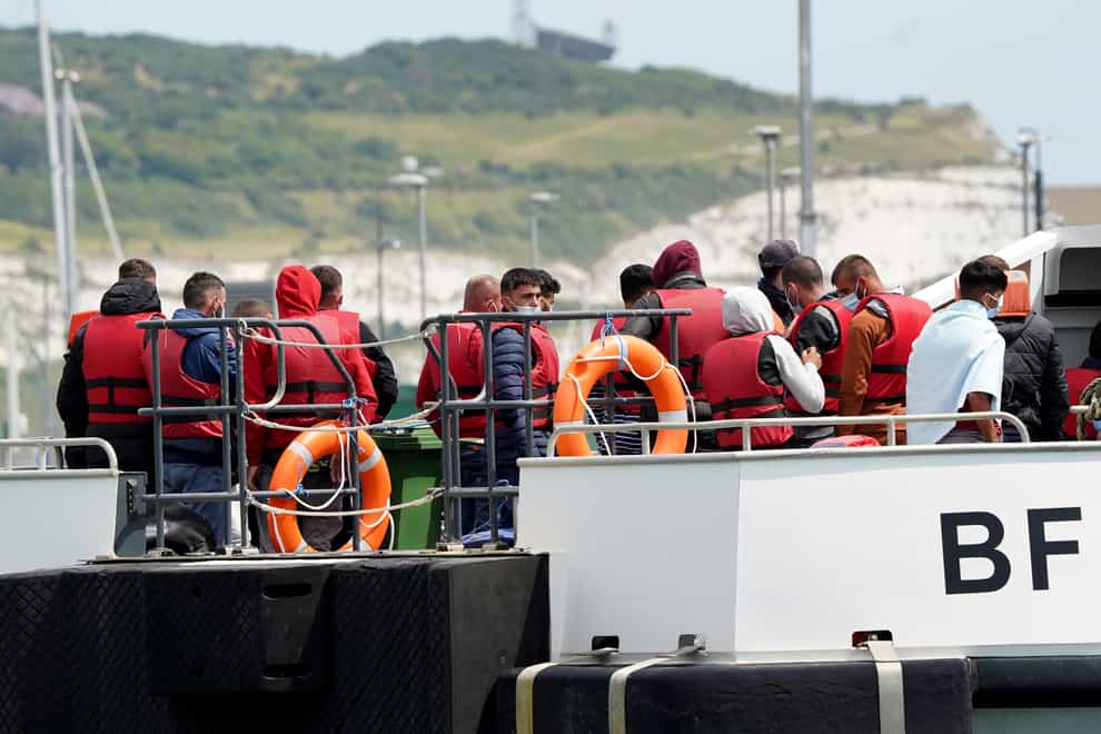 A group of people thought to be migrants are brought in to Dover, Kent, following a small boat incident in the Channel. Picture date: Thursday July 14, 2022. (Gareth Fuller/PA)