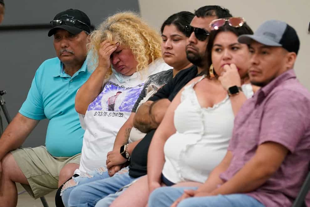 Families of shooting victims listen to the investigative committee release its report (Eric Gay/AP)