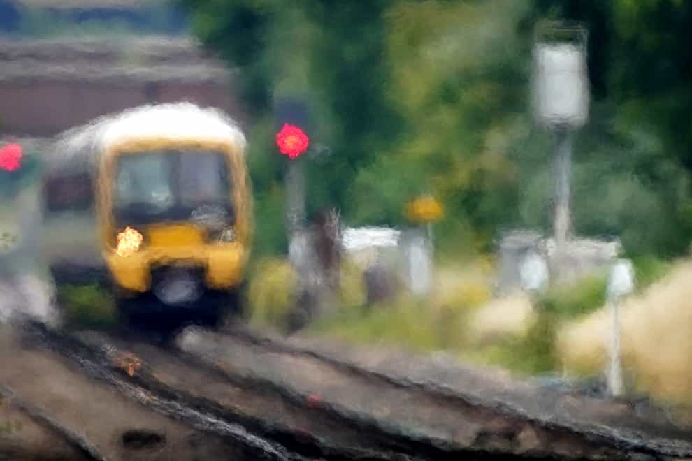 Speed restrictions imposed on trains amid fears of rails buckling in the heat could more than double journey times for passengers, the chief spokesman for Network Rail has said (Gareth Fuller/PA)