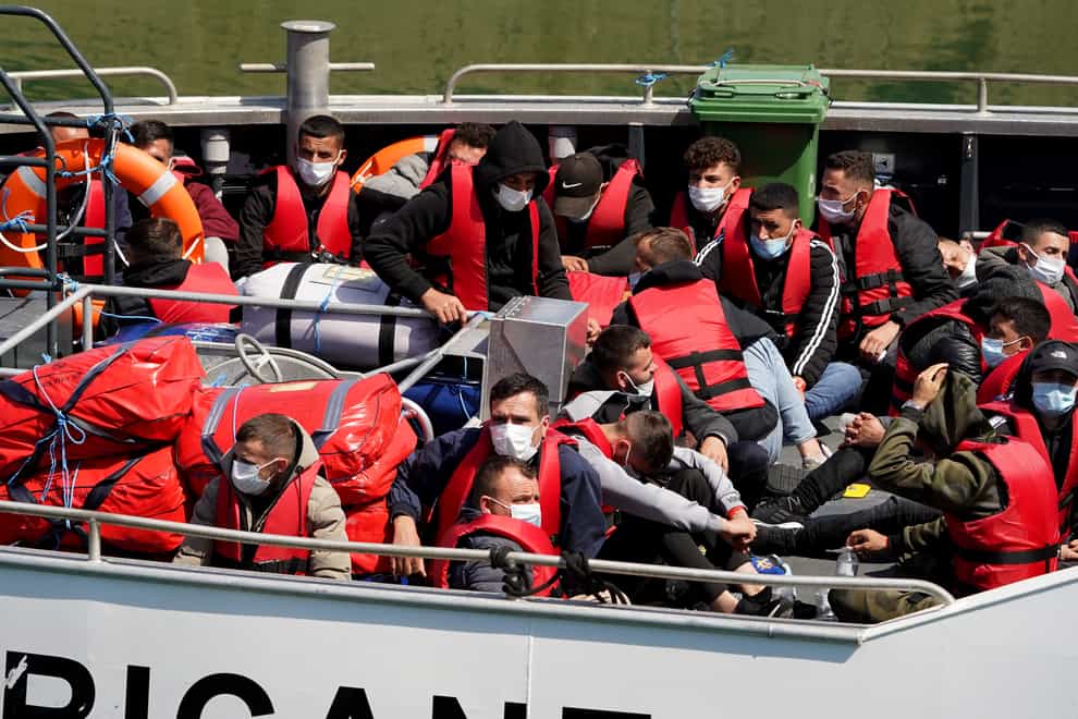 A group of people thought to be migrants are brought in to Dover, Kent, onboard a Border Force vessel following a small boat incident in the Channel (Gareth Fuller/PA)