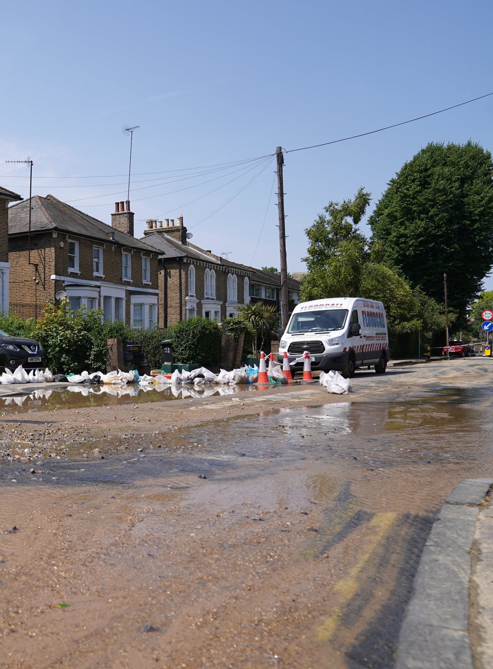 The aftermath on Queens Road, Kingston upon Thames after a burst water main flooded streets (Kirsty O’Connor/PA)