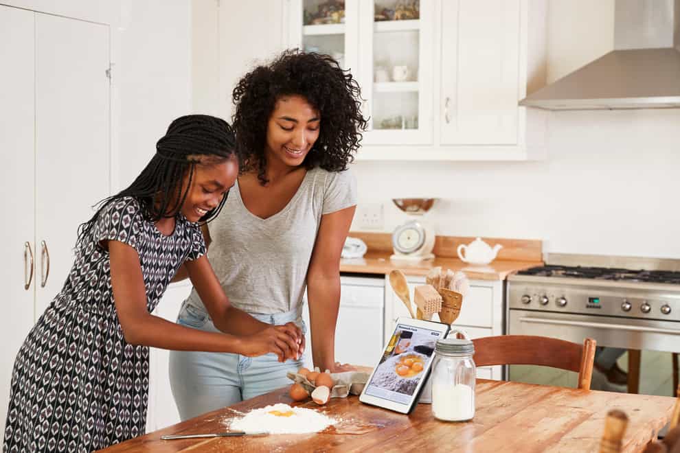 Teaching your teenagers how to cook doesn’t have to be expensive (Alamy/PA)