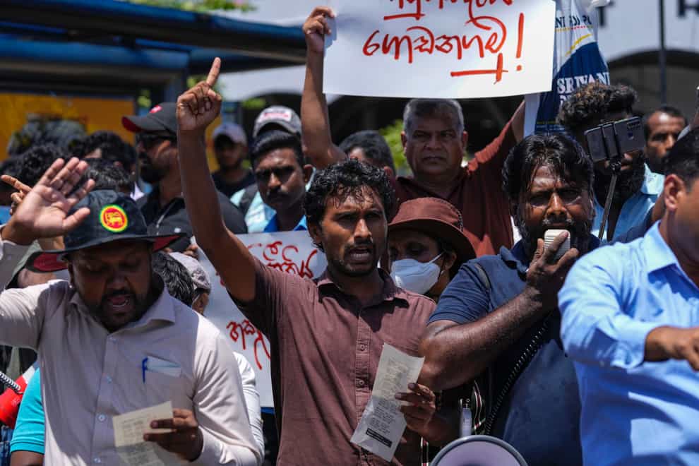 Protesters shout slogans against Ranil Wickremesinghe (Eranga Jayawardena/AP)