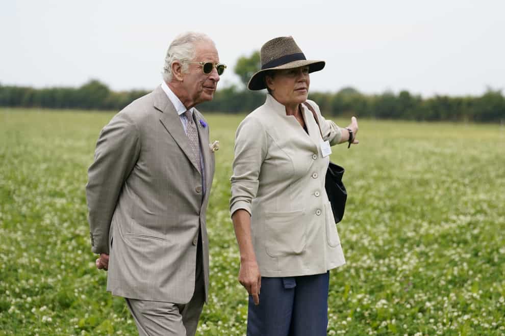Charles chats with Helen Browning, Group CEO Soil Association, as they walk through herbal leys as he attends the Innovative Farmers 10th anniversary at Trefranck Farm (Andrew Matthews/PA)