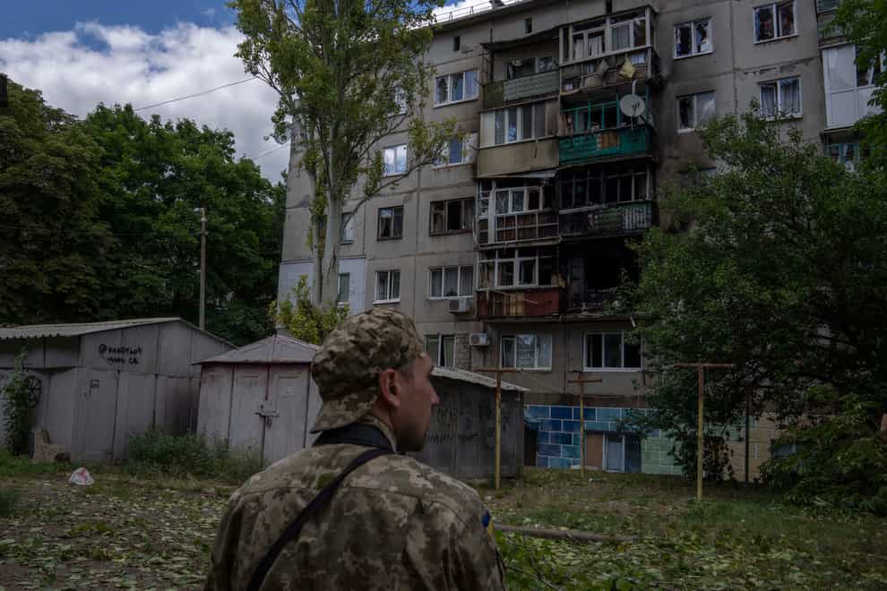 A Ukrainian soldier looks at five-story residential building damaged from a rocket attack on a residential area, in Kramatorsk, eastern Ukraine, Tuesday, July 19, 2022(Nariman El-Mofty/AP/PA))