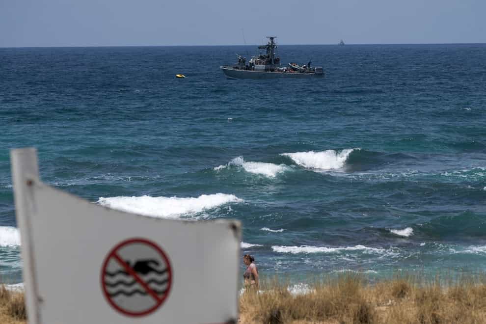An Israeli Navy vessel anchored in the Mediterranean Sea is seen from the Rosh Hanikra border crossing between Israel and Lebanon in northern Israel, July 3, 2022. The Israeli prime minister warned Lebanon on Tuesday, July 19, 2022, that any escalation on its northern border would be met with a harsh military response a day after the Israeli military said it intercepted a drone that crossed from Lebanese territory (Ariel Schalit/AP/PA)