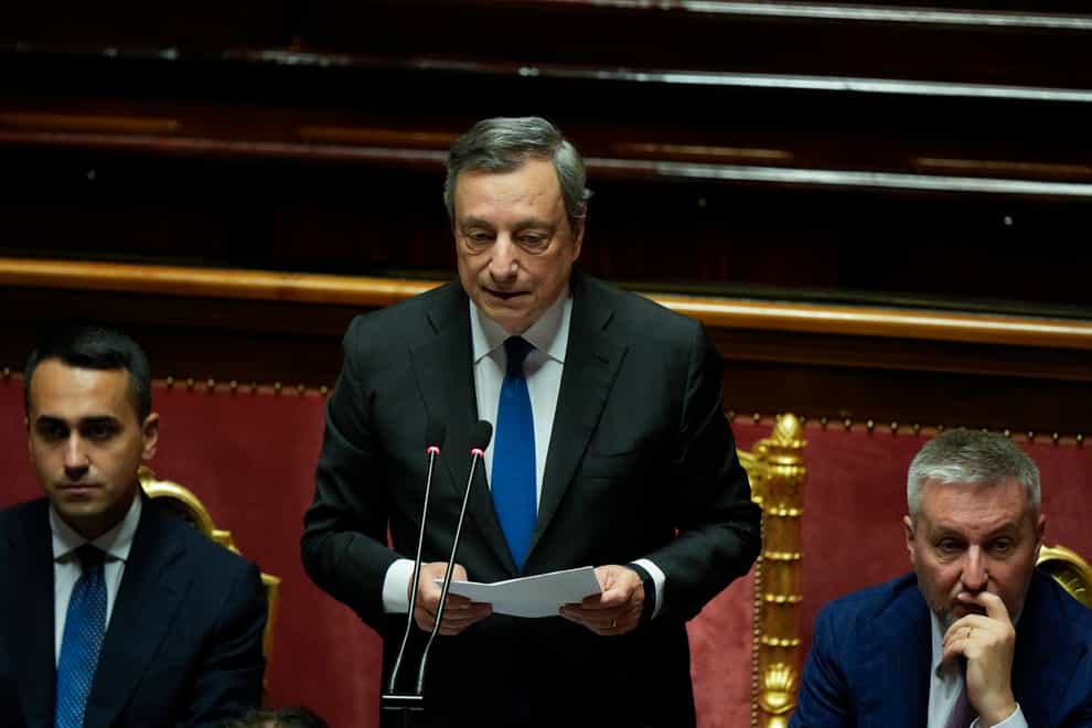 Italian Premier Mario Draghi, centre, delivers a speech at the Senate in Rome (Andrew Medichini)