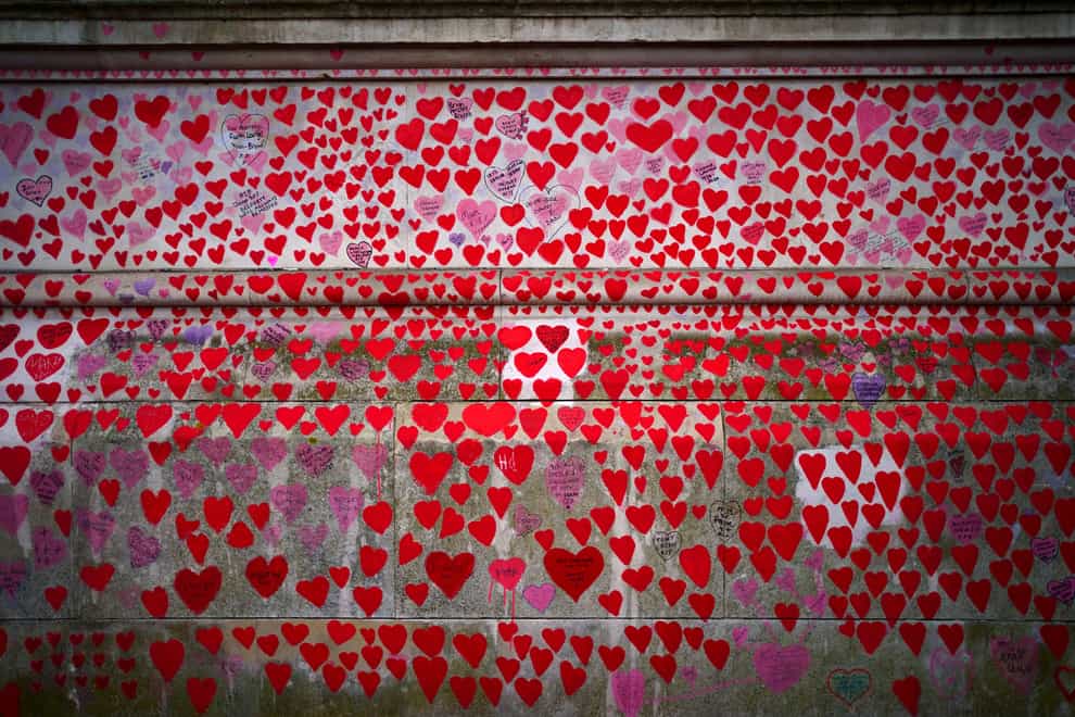 The National Covid Memorial Wall opposite the Palace of Westminster in central London, which bears hearts drawn by the relatives of people who have died of the virus (Victoria Jones/PA)