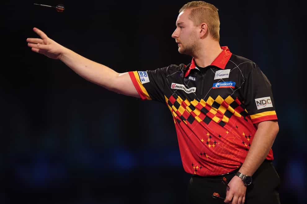 Dimitri Van Den Bergh knocked out reigning champion Peter Wright to win a classic at the World Matchplay in Blackpool (Adam Davy/PA)