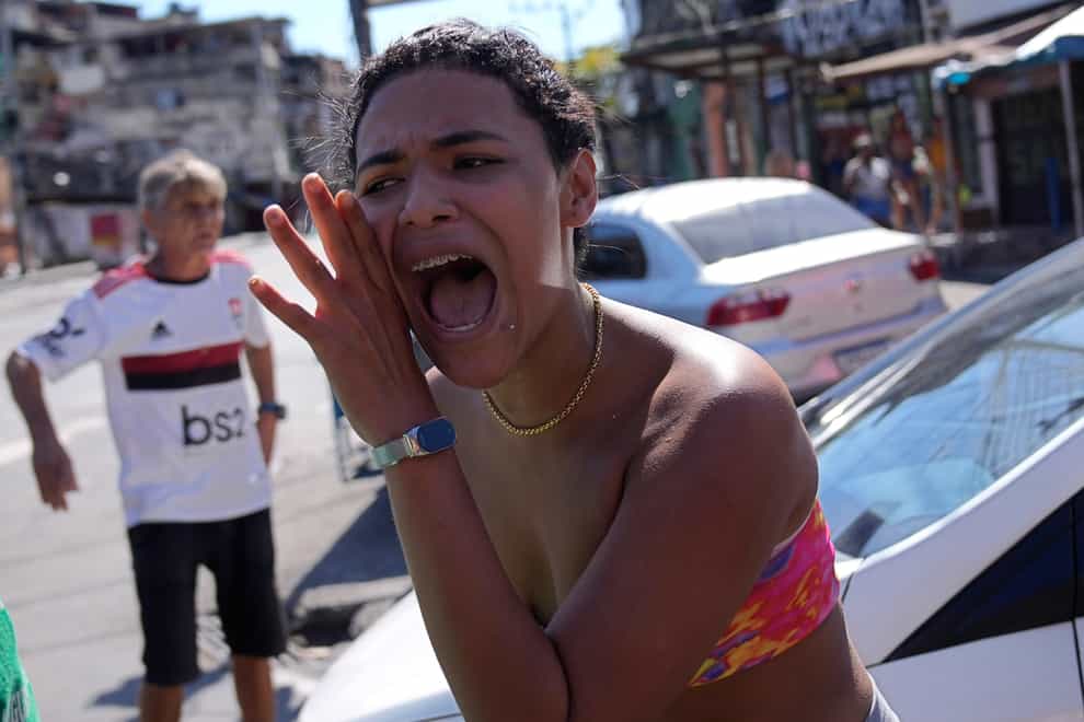 A raid of Rio de Janeiro’s largest complex of favelas that left at least 18 people dead has sparked renewed complaints of excessive police violence and ignited debate over how to handle crime ahead of state and presidential elections (Silvia Izquierdo/AP)