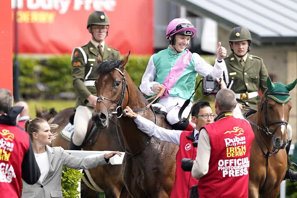 Colin Keane celebrates after winning the Dubai Duty Free Irish Derby with Westover (Niall Carson/PA)