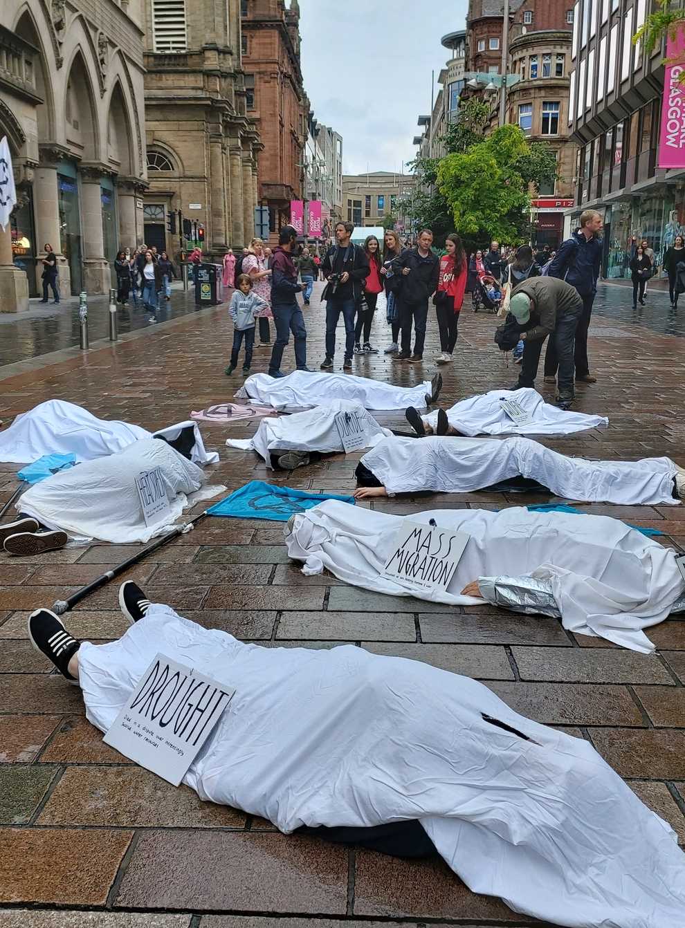 Extinction Rebellion protesters staged a ‘die in’ on Glasgow’s Buchanan Street following the heatwave. (Extinction Rebellion Scotland/PA)