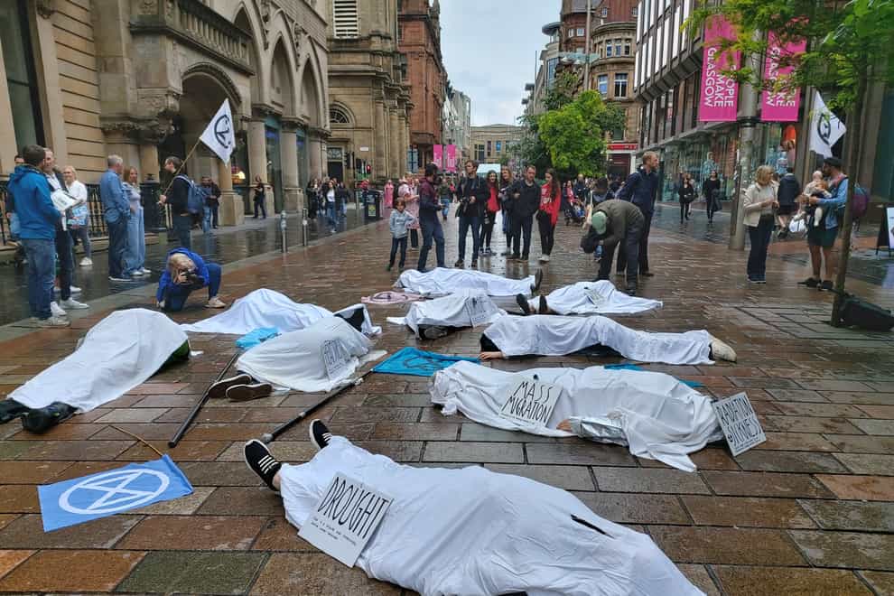 Extinction Rebellion protesters staged a ‘die in’ on Glasgow’s Buchanan Street following the heatwave. (Extinction Rebellion Scotland/PA)