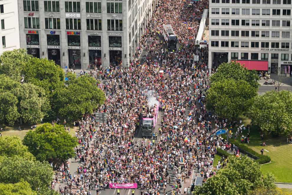 Revelers march down the Leipziger Strasse street on the Leipziger Platz square during the annual pride march in the German capital Berlin (AP)