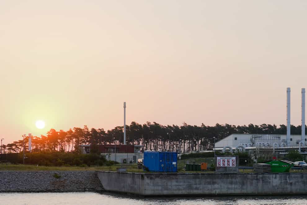 The sun rises behind the landfall facility of the Nord Stream 1 Baltic Sea pipeline and the transfer station of the OPAL gas pipeline, the Baltic Sea Pipeline Link, in Lubmin, Germany (Markus Schreiber/AP/PA)