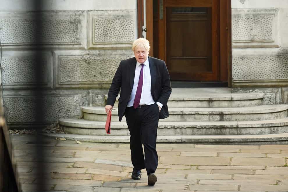 Then foreign secretary Boris Johnson leaves the Foreign Office (Victoria Jones/PA)