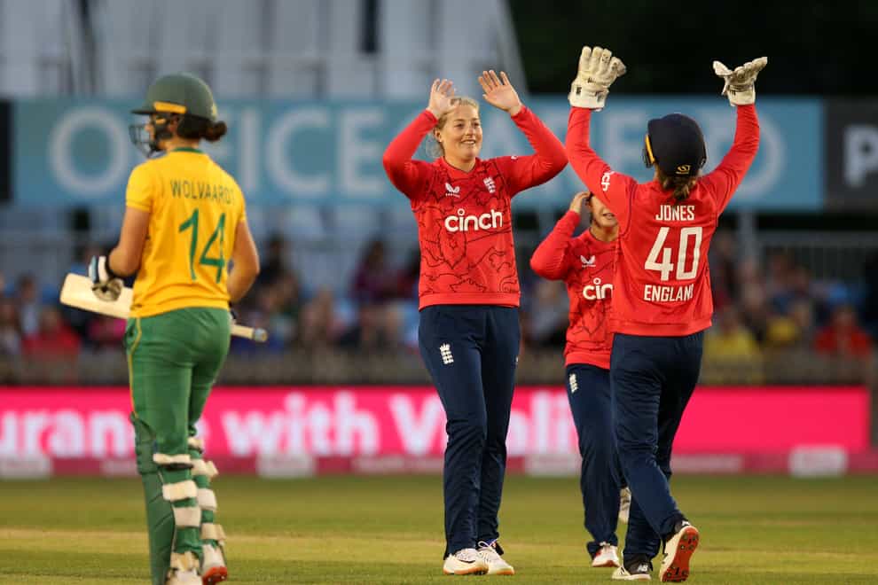 England’s Sophie Ecclestone, centre, celebrates after taking the wicket of South Africa’s Laura Wolvaardt (Nigel French/PA)