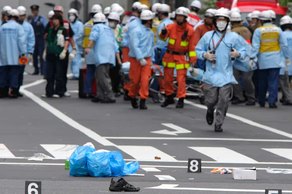 Shoes of victims were left on the street after the attack (Itsuo Inouye/AP)