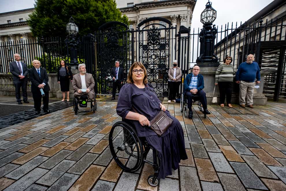 Belfast bomb victim Jennifer McNern (centre) begins a court bid over Troubles pension (PA)