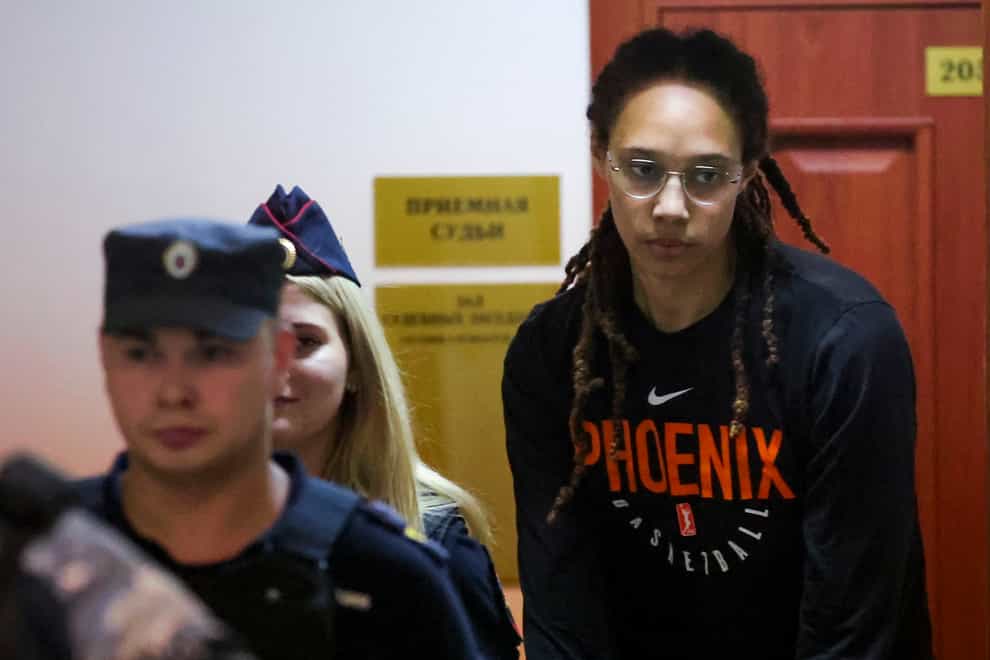 WNBA star and two-time Olympic gold medallist Brittney Griner is escorted to a courtroom for a hearing in Khimki, just outside Moscow, Russia (Evgenia Novozhenina/Pool Photo via AP)