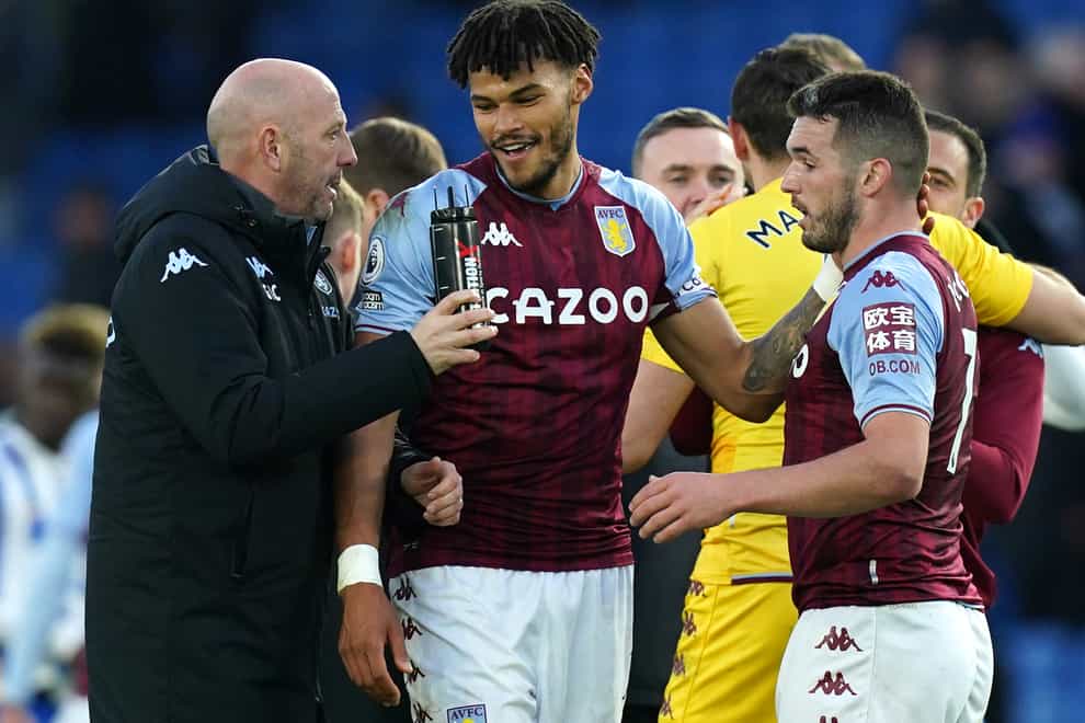 Tyrone Mings, centre, is being replaced as Aston Villa captain by John McGinn, right (Gareth Fuller/PA)