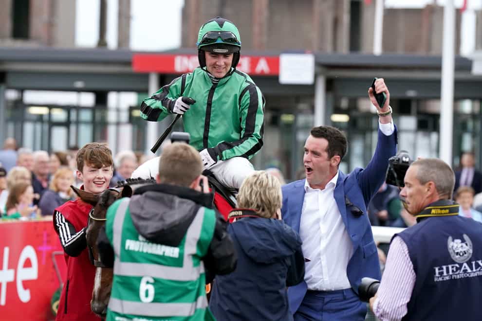 Hewick with owner TJ McDonald and Jockey Jordan Gainford in the parade ring after winning the The Tote Galway Plate during day three of the Galway Races Summer Festival 2022 at Galway Racecourse in County Galway, Ireland. Picture date: Wednesday July 27, 2022.