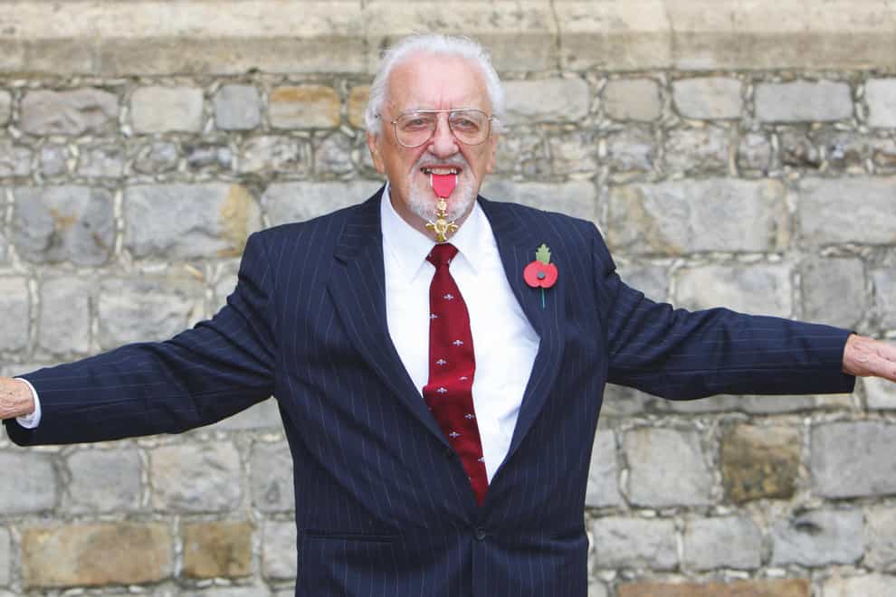 Bernard Cribbins with his OBE medal after receiving it during an investiture ceremony in 2011 (PA)