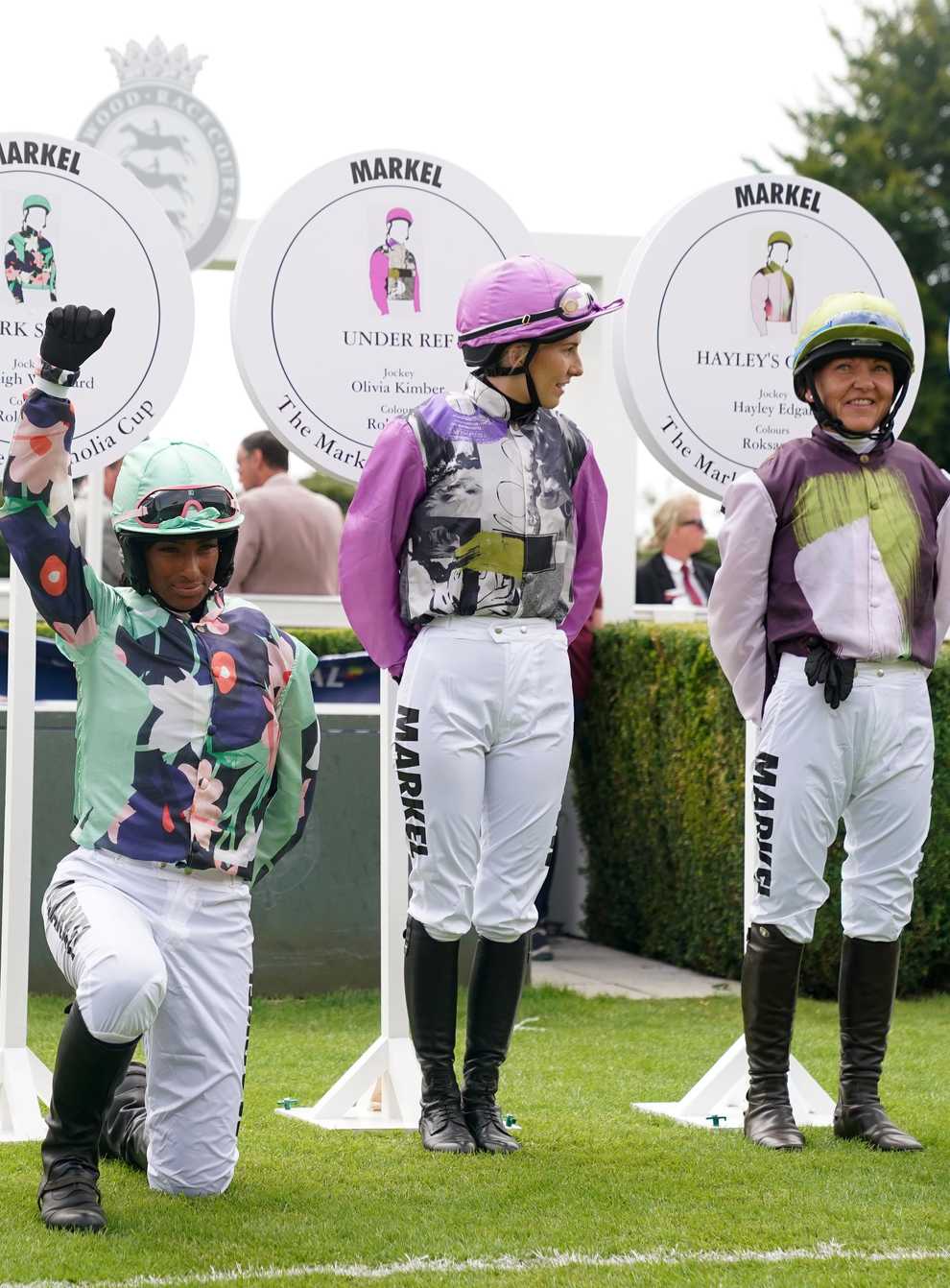 Jockey Ashleigh Wicheard takes the knee as jockeys are introduced for the Markel Magnolia Cup (Adam Davy/PA)
