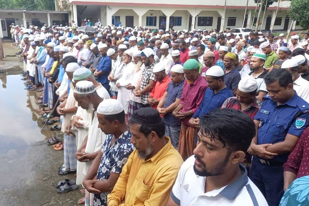 Hundreds gather to mourn the deaths of Rafiqul Islam, 51, and 16-year-old Mahiqul in Bangladesh (Family handout)