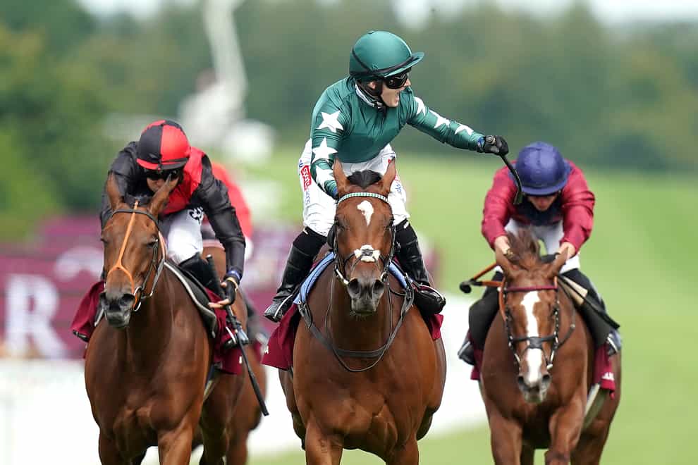 Nashwa ridden by jockey Hollie Doyle (centre) celebrates winning the Qatar Nassau Stakes on day three of the Qatar Goodwood Festival 2022 at Goodwood Racecourse, Chichester. Picture date: Thursday July 28, 2022.