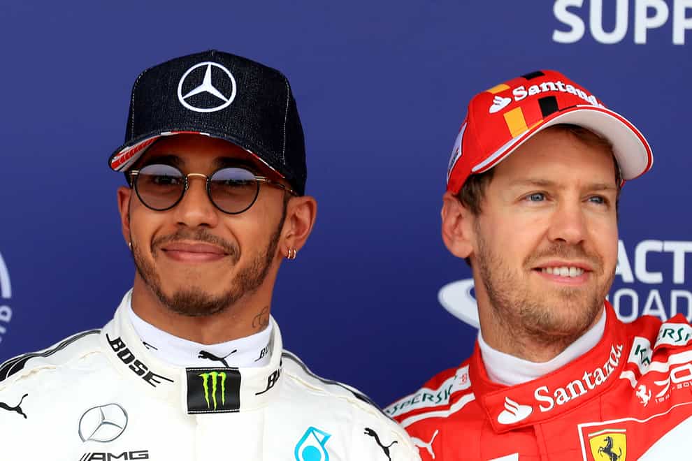 Lewis Hamilton and Sebastian Vettel (PA)