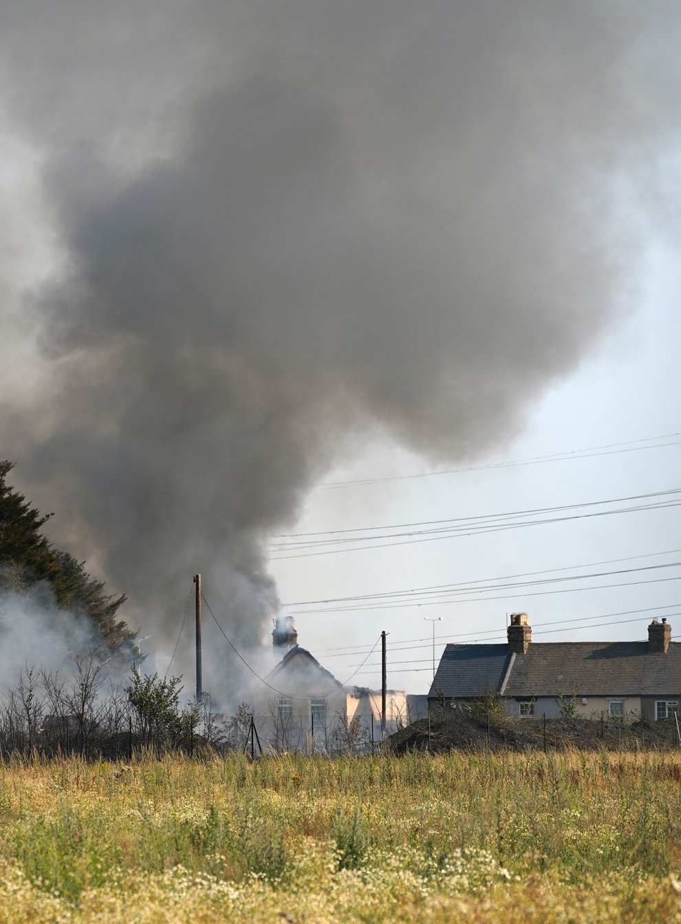 The scene of a blaze in the village of Wennington, sparked by the heatwave (Yui Mok/PA)