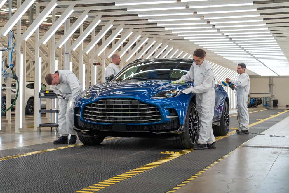 High demand for cars lifts sales for Aston Martin, but persistent supply chain disruption costs the carmaker millions (PA)