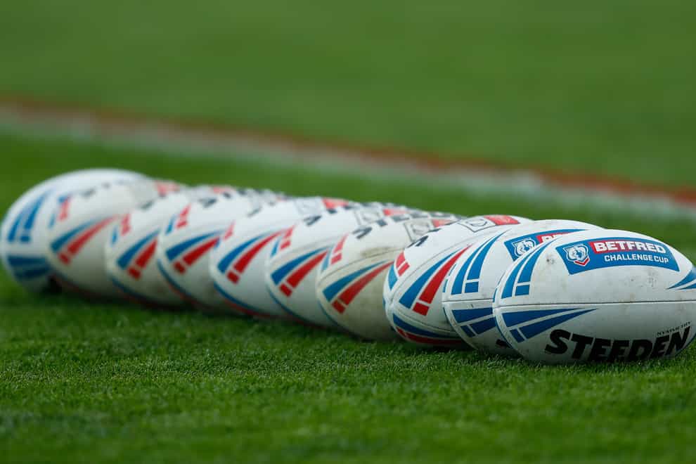 Rugby balls are laid out on the pitch ahead of the Betfred Challenge Cup, quarter final match at the Sewell Group Craven Park, Hull. Picture date: Friday April 8, 2022.
