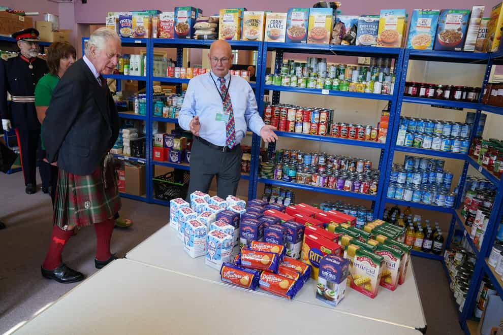 The Prince of Wales, known as the Duke of Rothesay when in Scotland, meets volunteers and supporters of Caithness food bank at Carnegie Library in Wick (Andrew Milligan/PA)