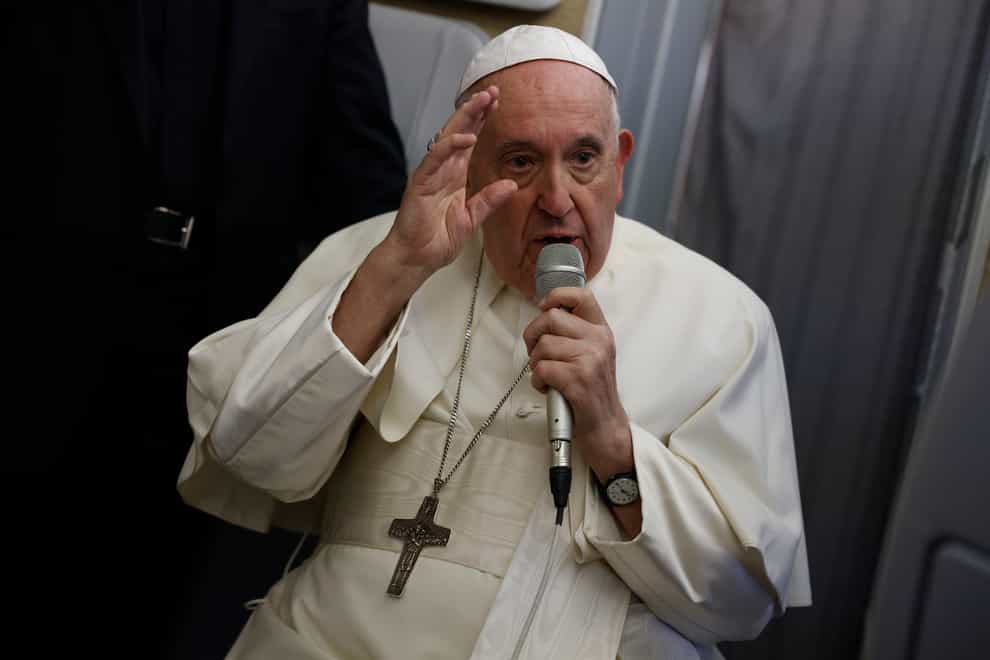 Pope Francis speaks to journalists aboard the papal flight back from Canada (Guglielmo Mangiapane/ Pool via AP)