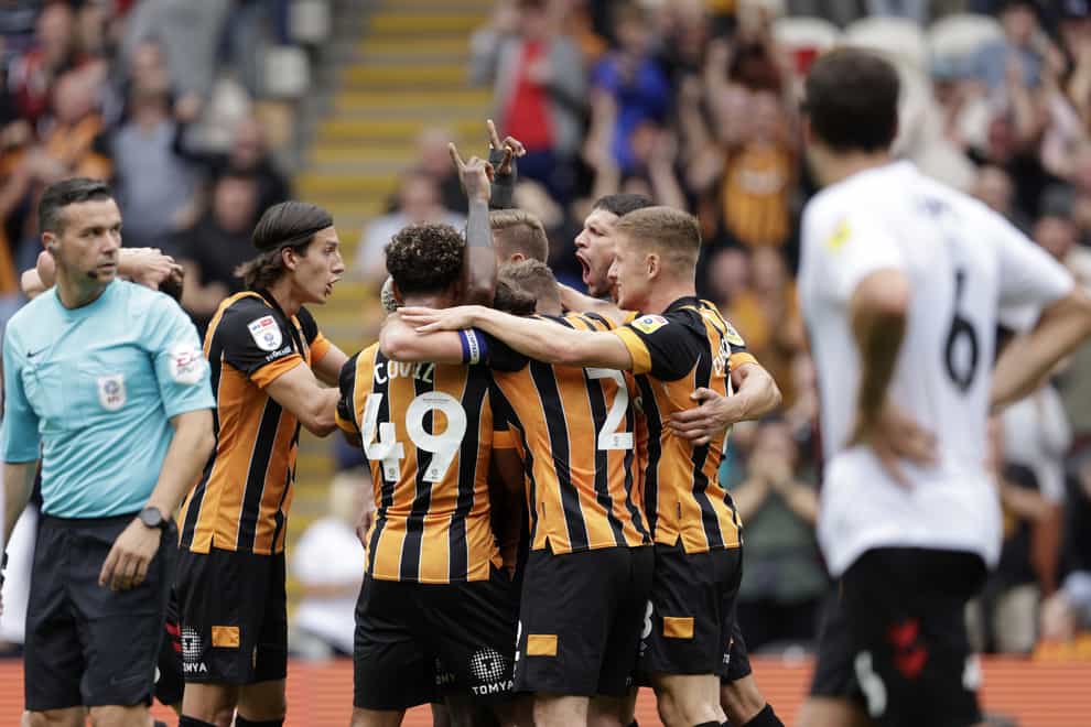 Hull City’s Jean Michael Seri is mobbed by his team mates after scoring the winner during the Sky Bet Championship match at the MKM Stadium (Richard Sellers/PA)