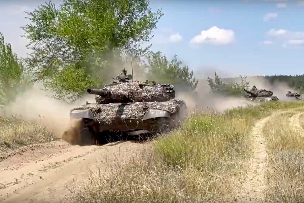 Tanks of the 2nd Army Corps of the People’s Militia of the Luhansk People’s Republic on a mission at an undisclosed location in Ukraine (Russian Defence Ministry Press Service/AP)