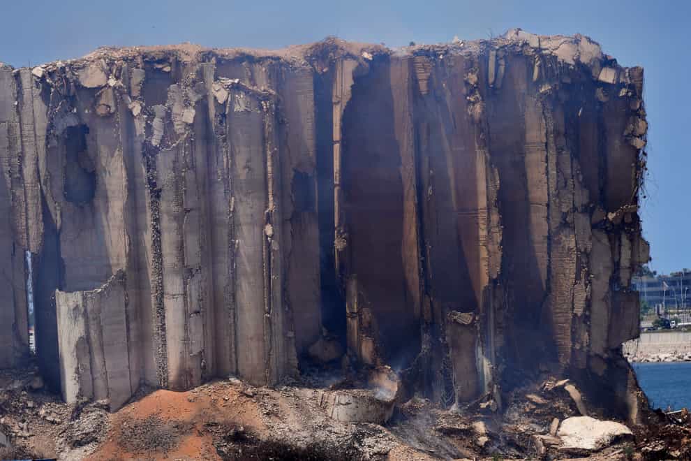 Smoke rises from the silos which were damaged during the massive explosion in 2020 (Hussein Malla/AP)