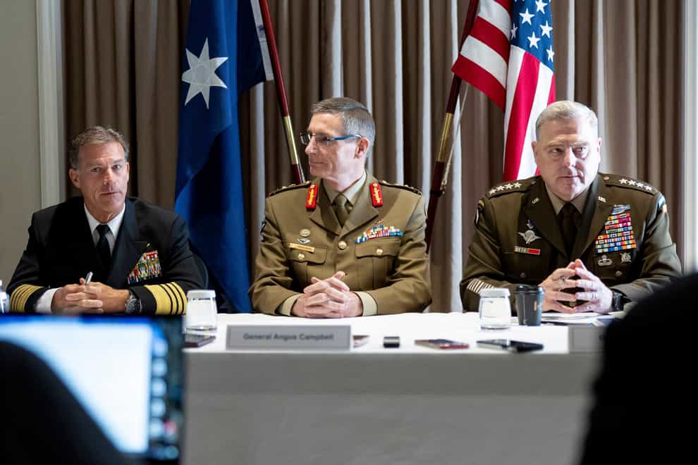 The Chief of the Australian Defence Force, General Angus Campbell, center, is joined by United States Chairman of the Joint Chiefs of Staff, Gen. Mark Milley, right, and Commander, U.S. Indo-Pacific Command, Admiral John Aquilino, to discuss the US-Australia Alliance in Sydney on Wednesday, July 27, 2022 (Jay Cronan/ADF via AP/PA)