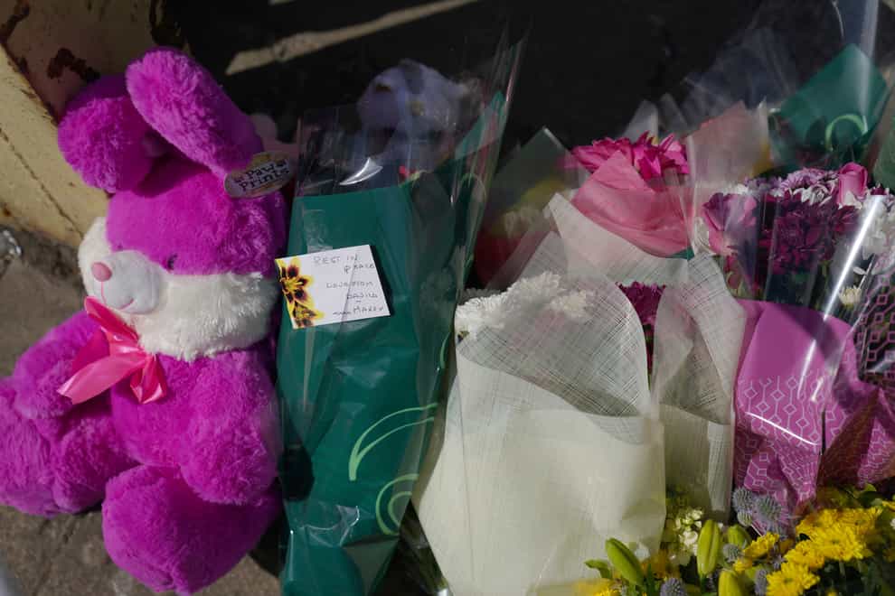Floral tributes left near to the scene in Boston (Joe Giddens/PA)