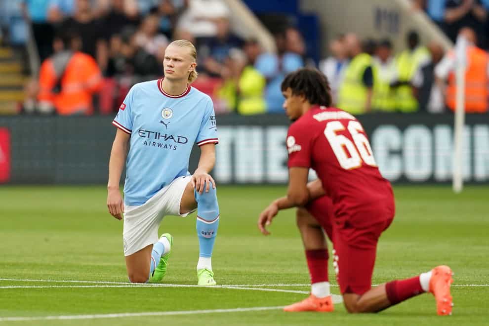 Manchester City’s Erling Haaland and Liverpool’s Trent Alexander-Arnold take the knee before the Community Shield (Nick Potts/PA)