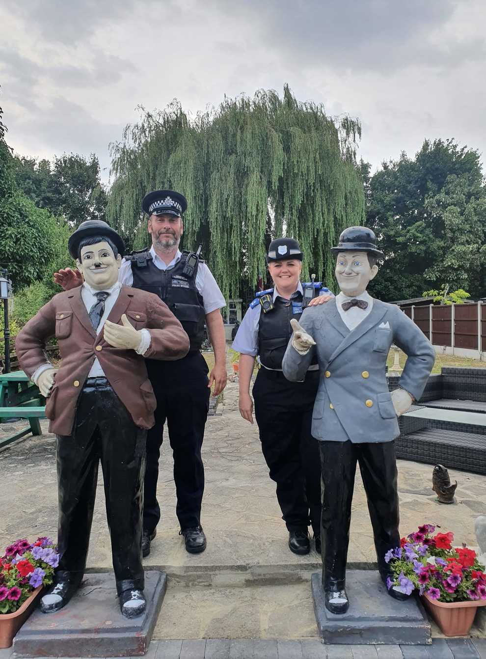 Sergeant Richard Ruane and PCSO Natalie Parrott with the Laurel and Hardy statues (Lesley Haylett/PA)