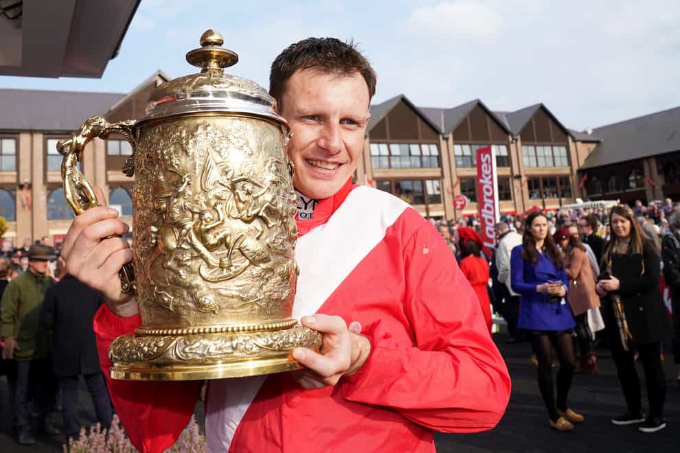 Jockey Paul Townend with the Ladbrokes Punchestown Gold Cup after winning with Allaho on day two of the Punchestown Festival at Punchestown Racecourse in County Kildare, Ireland. Picture date: Wednesday April 27, 2022.