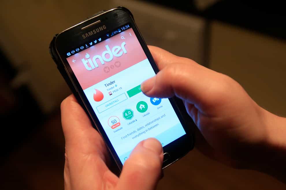 The Tinder app in use on a Samsung smartphone.